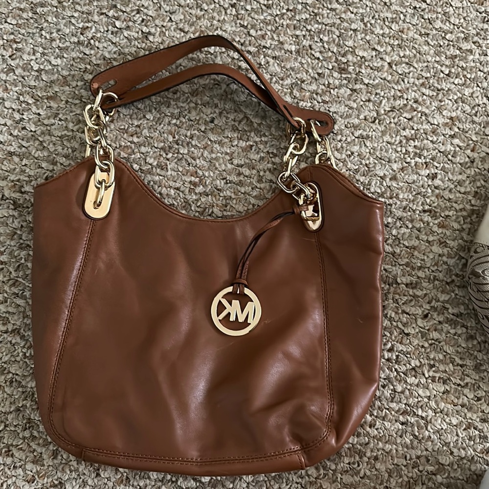 Michael Kors caramel hobo medium in size short strap causal bag. Light wear….!..